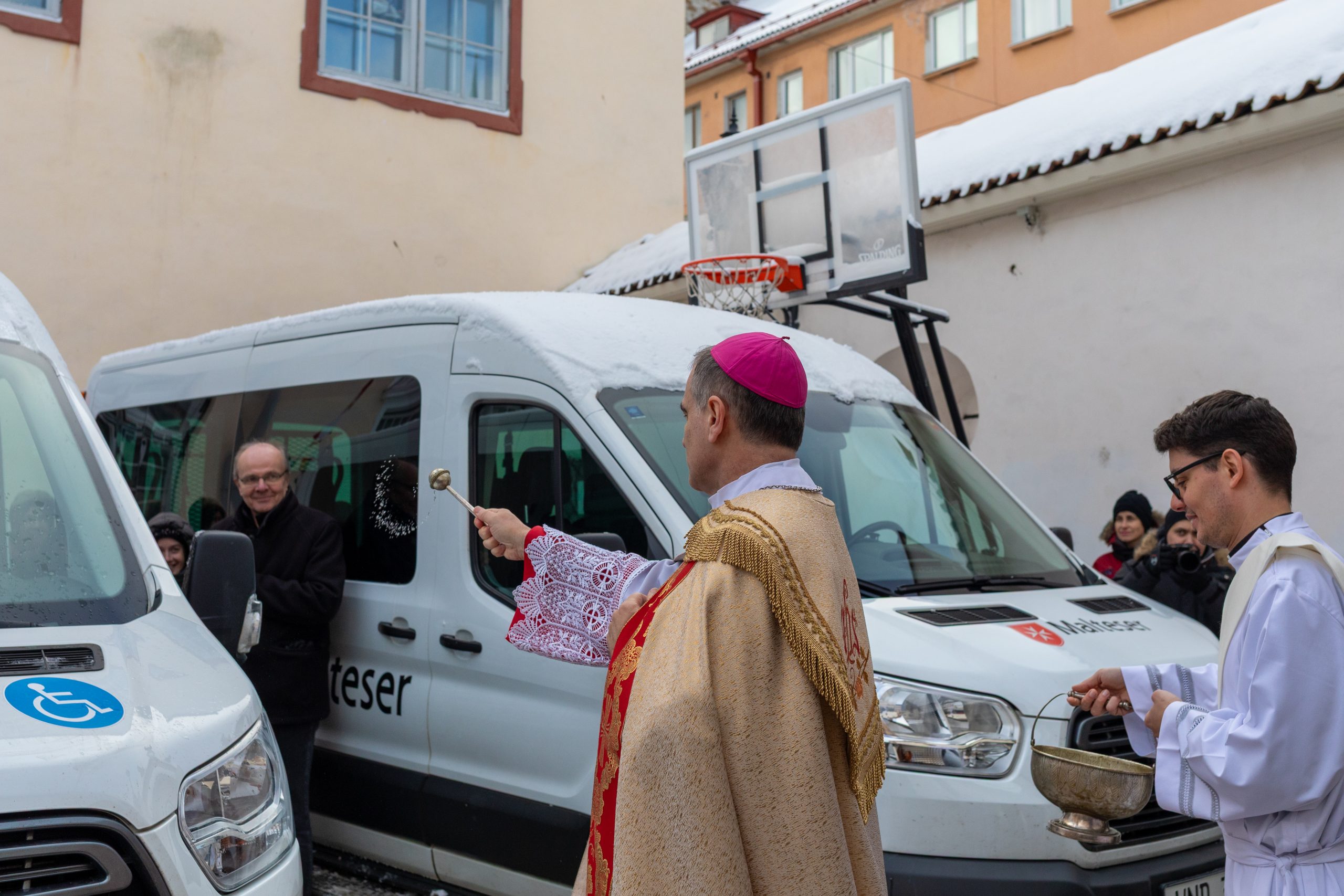 Two minivans of OMRO Estonia blessed by Bishop Philippe Jourdan